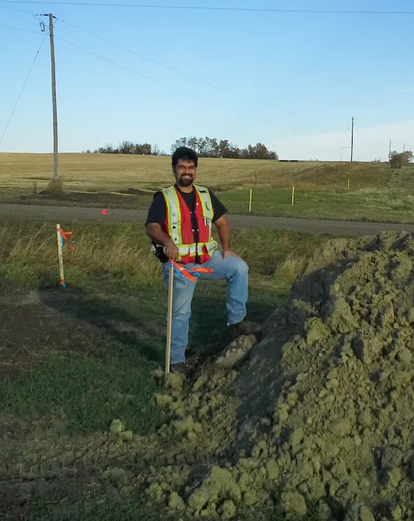 Clayton Smith surveying in Central Alberta